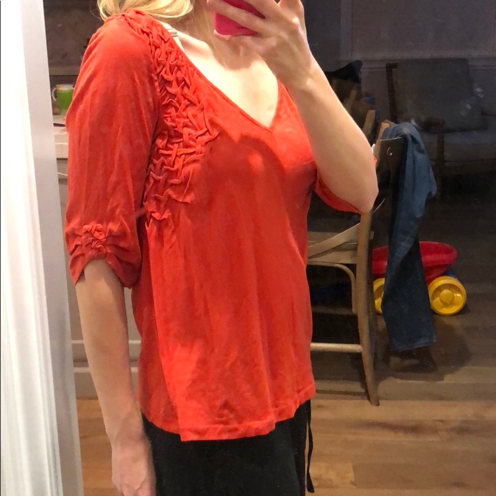 Med rust/burnt orange top. Runs big.